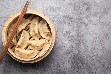 Asian dumplings in bamboo steamer