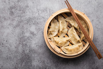 Asian dumplings in bamboo steamer