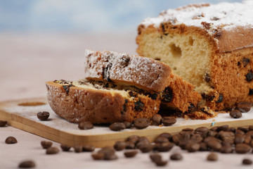 Delicious homemade cake with raisins on a light wooden background. close-up. rustic. copy space.