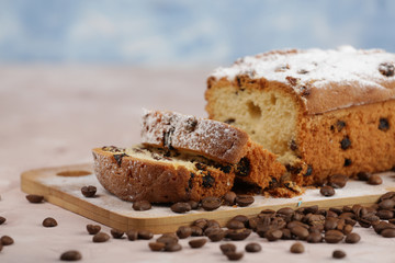 Delicious homemade cake with raisins on a light wooden background. close-up. rustic. copy space.