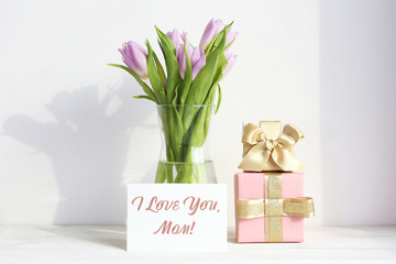 Multy purpose fresh flower composition, bouquet of purple tulips. International Women's day, mother's day greeting concept. Copy space, close up, top view, flat lay, background.