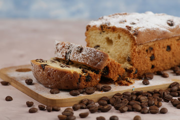 Delicious homemade cake with raisins on a light wooden background. close-up. rustic. copy space.