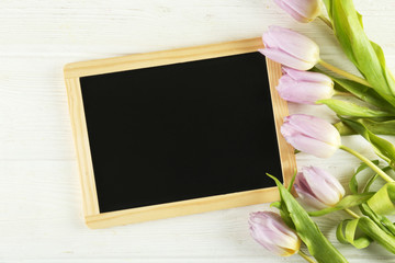 Multy purpose fresh flower composition, bouquet of purple tulips. International Women's day, mother's day greeting concept. Copy space, close up, top view, flat lay, background.