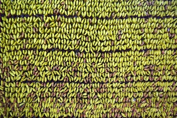 Wall filled with folded paper temple offerings in Southeast Asia horizontal background texture