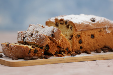 Delicious homemade cake with raisins on a light wooden background. close-up. rustic. copy space.