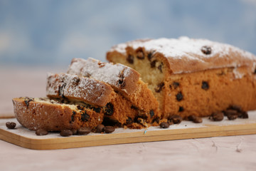 Delicious homemade cake with raisins on a light wooden background. close-up. rustic. copy space.