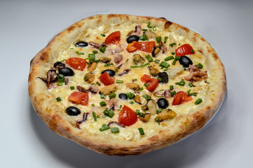 pizza with ham and cheese on plate isolated on white