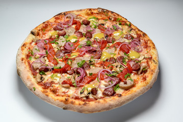 pizza with ham and tomatoes isolated on white