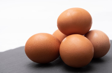  raw eggs on a natural background