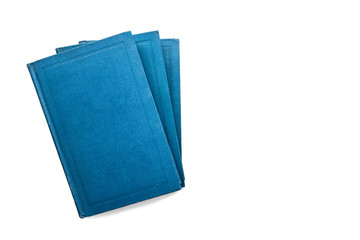tree blue beautiful closed books on white isolated background. beautiful blue books cover. a row of beautiful blue books. stack of books view from the top
