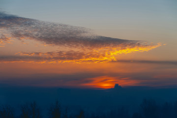 Fototapeta premium Sunny shine on clouds. Wonderful vivid dawn. Beautiful calm sunset. Scenic tranquil sunrise. Amazing peaceful cloudy sky. Sun above horizon. Picturesque sundown. Atmospheric cloudscape. Background.