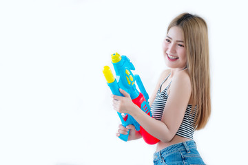 Asian sexy woman with gun water in hand on white background,Festival songkran day at thailand,The best of festival of thai,Land of  smile