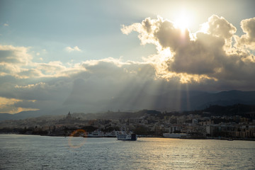 Naklejka na ściany i meble Beautiful view of cityscape and harbor of Messina from ferry, Sicily, Italy