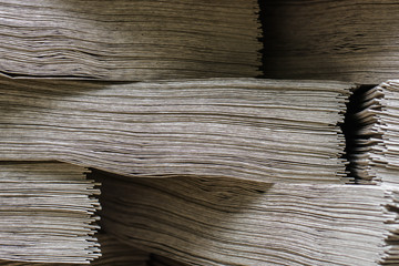 Side View Of Huge Stack of Recycled Paper close up. Business concept. Huge Stack of Recycled Paper envelopes closeup. Eco Kraft paper.