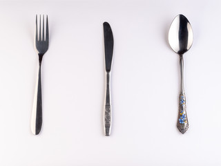 knife, spoon and fork isolated on white background