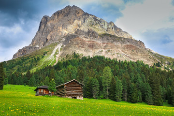 Wooden cabin on a meadow in Dolomites