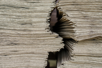 Side View Of Huge Stack of Recycled Paper close up. Business concept. Huge Stack of Recycled Paper envelopes closeup. Eco Kraft paper.