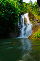 Fototapeta na wymiar Landscape of natural waterfall in Khun Dan Prakarnchon Dam at Nakhon Nayok, Thailand