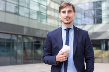 Portrait of cheerful male standing outdoor