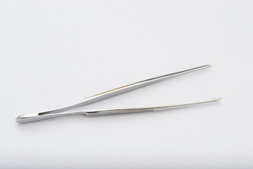 debakey forceps on the white surface