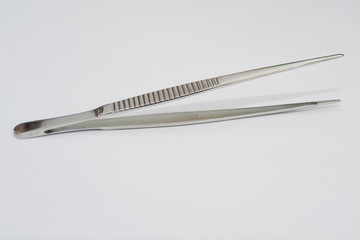 debakey forceps on the white surface