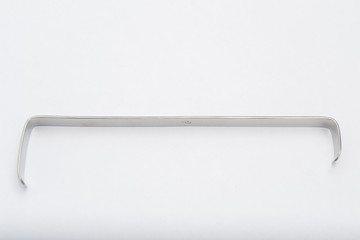 surgical retractor on white surface