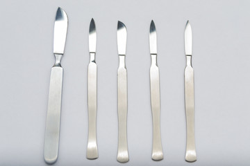 Different One-Piece Scalpels on white background