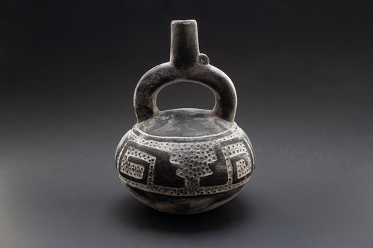 Pre-columbian ceramic pitcher or "Huaco" from Chimu, an ancient Peruvian culture. Pre inca handcrafted pottery piece made by this ancient civilization.