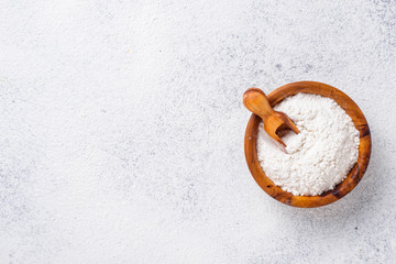 Wheat flour in wooden bowl