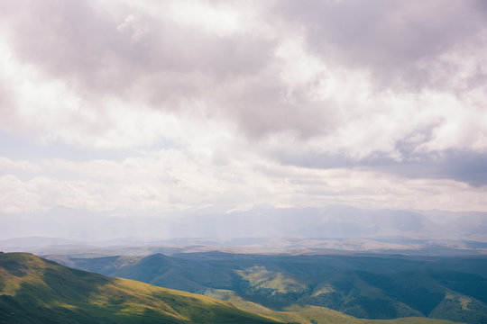 View from the Bermamyt Plateau on a summer day. Hills and clouds in the distance. © dmitriydanilov62