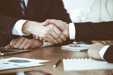 Business people shaking hands at meeting or negotiation in the office. Handshake concept. Partners are satisfied because signing contract