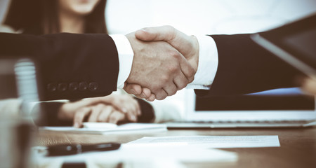 Business people shaking hands at meeting or negotiation in the office. Handshake concept. Partners are satisfied because signing contract