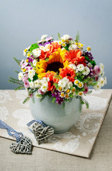 Bouquet of flowers: sunflower, matricaria, dahlia, daisy, chrysanthemum.