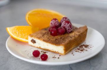 orange and berry pie on a plate