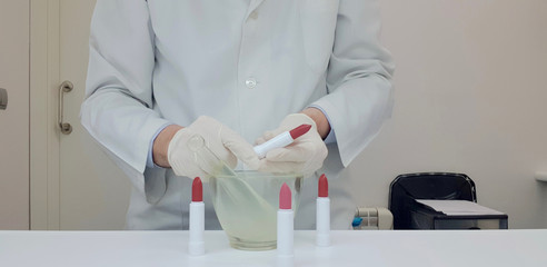 Checking lipsticks in the cosmetics laboratory