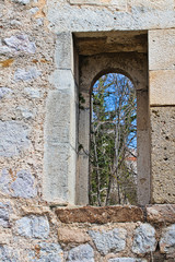 a small window in a castle made of stone
