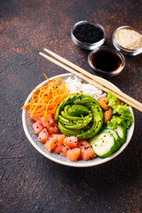 Hawaiian poke bowl with salmon, rice and vegetable