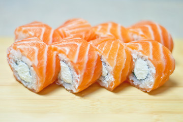 Rainbow Sushi Roll with salmon, eel, tuna, avocado, royal prawn, cream cheese Philadelphia, caviar tobica, chuka. Sushi menu. Japanese food.