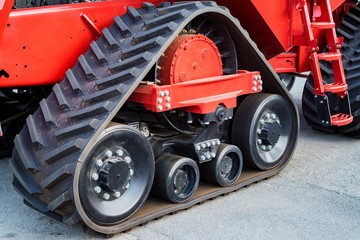 A close up of modern rubber tractor tracks