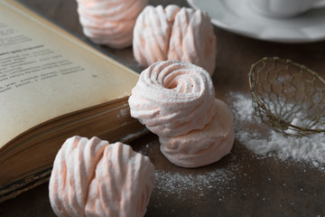 Homemade zephyr and mint on an old wooden table covered 