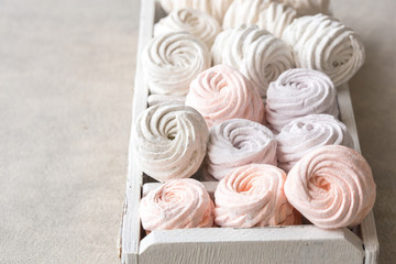 Homemade zephyr and mint on an old wooden table covered 