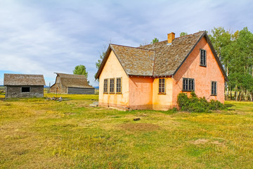 Less frequently photographed view of Moulton Barn with Pink Stucco House in foreground