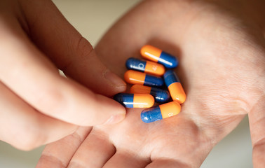 Colorful pills and medicines in the hand 