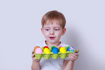 Fototapeta na wymiar Boy with painted eggs