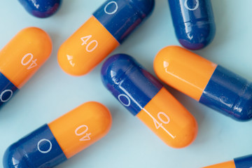 medical pills on blue background. Healthcare concept.
