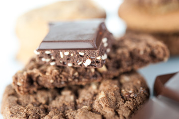 Various shortbread, oat cookies, chocolate chip biscuit and pieces of chocolate with seeds and nuts.