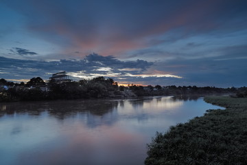 River view evening of Maeklong river with colorful of sun light in the sky background, twilight at Maeklong river in Banpong, Ratchaburi, Thailand.