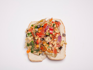 vegetable omelet in a black iron pan On a white background