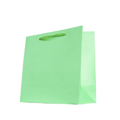 Green cardboard bag with a ribbon, for shopping, isolated on a white background.
