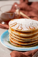 Pancakes Close Up, Delicious breakfast of pancakes with honey and sugar powder, close up view